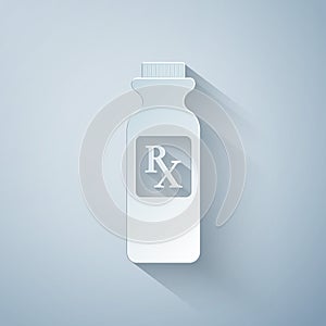 Paper cut Pill bottle with Rx sign and pills icon isolated on grey background. Pharmacy design. Rx as a prescription