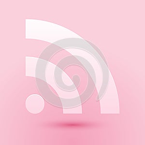 Paper cut RSS icon isolated on pink background. Radio signal. RSS feed symbol. Paper art style. Vector