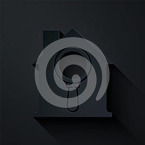 Paper cut Search house icon isolated on black background. Real estate symbol of a house under magnifying glass. Paper