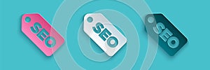 Paper cut SEO optimization icon isolated on blue background. Paper art style. Vector