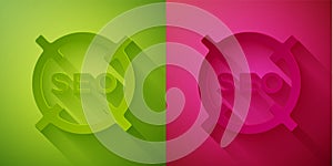 Paper cut SEO optimization icon isolated on green and pink background. Paper art style. Vector