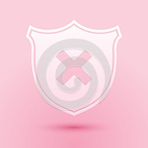 Paper cut Shield and cross x mark icon isolated on pink background. Denied disapproved sign. Protection, safety