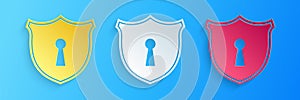 Paper cut Shield with keyhole icon isolated on blue background. Protection and security concept. Safety badge icon. Privacy banner