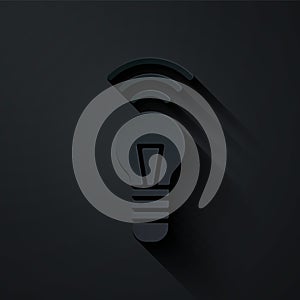 Paper cut Smart light bulb system icon isolated on black background. Energy and idea symbol. Internet of things concept