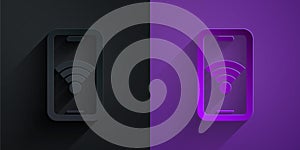 Paper cut Smartphone with free wi-fi wireless connection icon isolated on black on purple background. Wireless