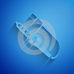 Paper cut Soldering iron icon isolated on blue background. Paper art style. Vector