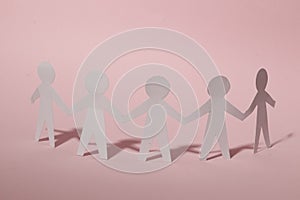 Paper cut Style concept of a leader and relationship with friendship and hand-holding of people in symbolic form on Inspiration st