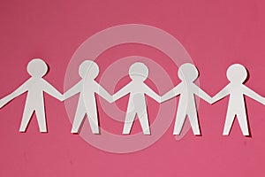 Paper cut Style concept of a leader and relationship with friendship and hand-holding of people in symbolic form on Inspiration st