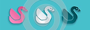 Paper cut Swan bird icon isolated on blue background. Animal symbol. Paper art style. Vector