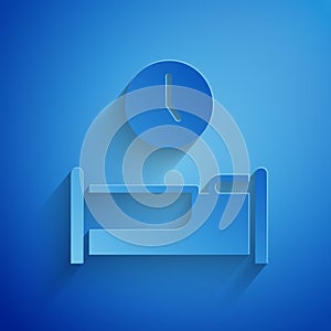 Paper cut Time to sleep icon isolated on blue background. Paper art style. Vector