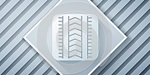 Paper cut Tire track icon isolated on grey background. Paper art style. Vector