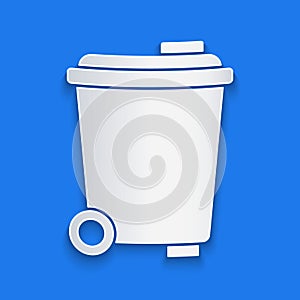 Paper cut Trash can icon isolated on blue background. Garbage bin sign. Recycle basket icon. Office trash icon. Paper