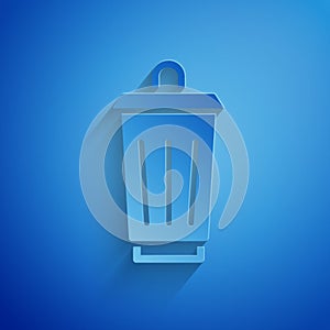 Paper cut Trash can icon isolated on blue background. Garbage bin sign. Recycle basket icon. Office trash icon. Paper