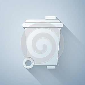 Paper cut Trash can icon isolated on grey background. Garbage bin sign. Recycle basket icon. Office trash icon. Paper