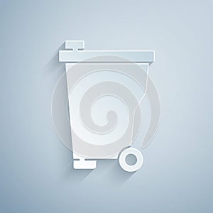 Paper cut Trash can icon isolated on grey background. Garbage bin sign. Recycle basket icon. Office trash icon. Paper