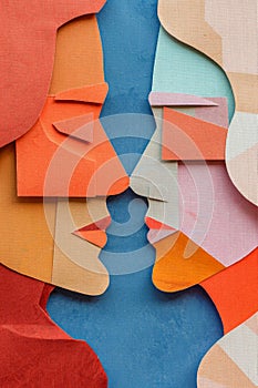 Paper cut of two human faces with colored paper sheets in the foreground. Book cover illustration.