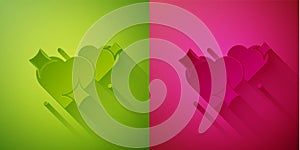 Paper cut Two Linked Hearts icon isolated on green and pink background. Romantic symbol linked, join, passion and