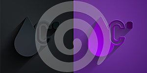 Paper cut Water temperature icon isolated on black on purple background. Paper art style. Vector