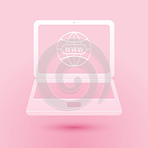 Paper cut Website on laptop screen icon isolated on pink background. Globe on screen of laptop symbol. World wide web