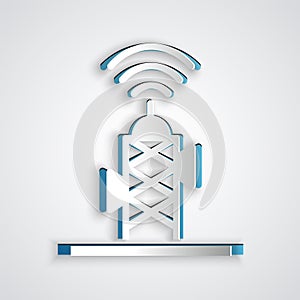Paper cut Wireless antenna icon isolated on grey background. Technology and network signal radio antenna. Paper art