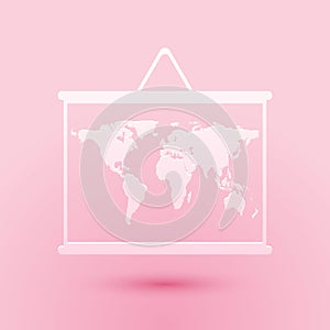 Paper cut World map on a school blackboard icon isolated on pink background. Drawing of map on chalkboard. Paper art