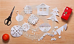 Paper decoration, candle, mandarin and scissors