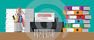 Paper document in shredder machine.