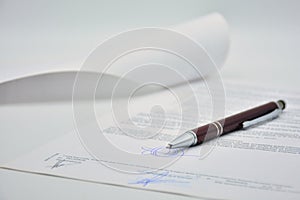 Document signed with a pen, contract photo