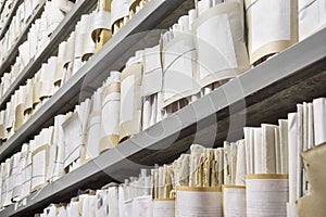 Paper documents stacked in archive