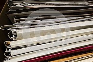 Paper documents stacked in archive. Old folders with documents in the box. office files background texture, closeup