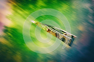 The paper dollar plane without shadow isolated on a white background, a concept of take-off or falling currency in the world