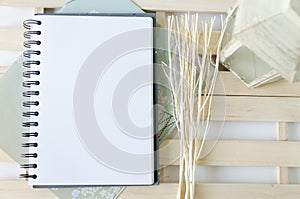 Paper, dry branch and lander on the wooden pallets