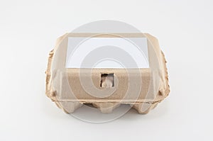 Paper egg box - egg carton on white background.