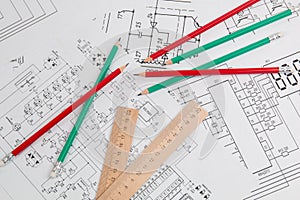 Paper electrical engineering drawings and pencils
