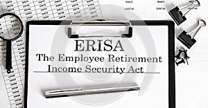 Paper with Employee Retirement Income Security Act ERISA on a table