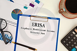 Paper with ERISA - Employee Retirement Income Security Act on the table