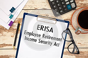 Paper with ERISA - Employee Retirement Income Security Act on the table