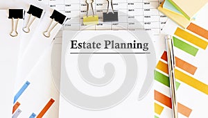 Paper with ESTATE PLANNING on a table with chart