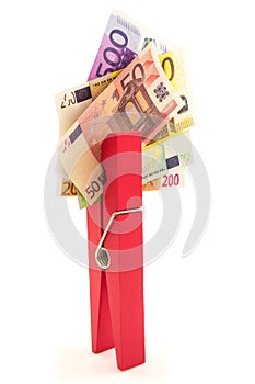 Paper euro money with red clothes peg