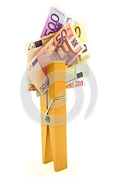 Paper euro money with yellow clothes peg