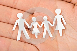 Paper family in hand