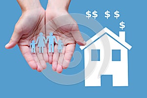 Paper family in hands with white home on blue background welfare concept