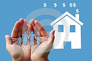 Paper family in hands with white home on blue background welfare concept