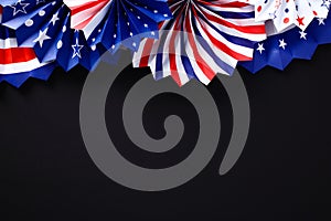 Paper fans in USA flag colors on black background. Banner mockup for Veterans Day, Memorial Day, 4th of July