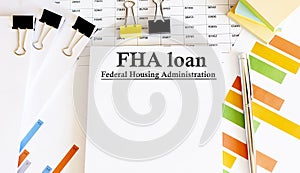 Paper with FHA loan on a chart