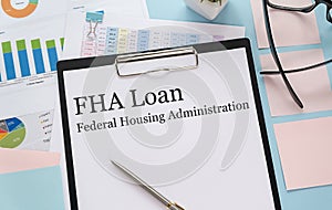 Paper with FHA loan on a table