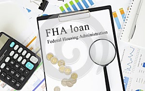Paper with FHA loan on a table with pen