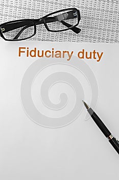 Paper with Fiduciary duty on a table