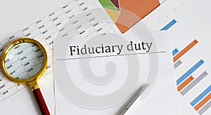 Paper with Fiduciary duty on a table