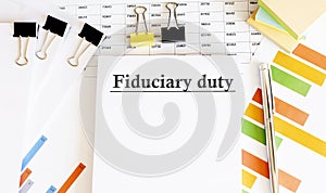 Paper with Fiduciary duty on a table
